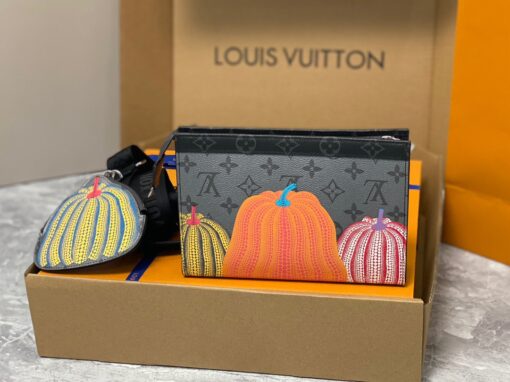 LOUIS VUITTON X YAYOI KUSAMA Gaston Wearable Wallet. High-End Quality Bag including gift box, care book, dust bag, authenticity card. On-trend and practical, the LVxYK Gaston wallet joins the “Pumpkins” theme of the Louis Vuitton x Yayoi Kusama collection with a vibrant new look. The venerated Japanese artist’s iconic pumpkins are printed in bright colors on Monogram Eclipse Reverse canvas. And it comes with a removable pumpkin-shaped pouch, perfect for coins and contactless payment cards. | CRIS AND COCO Authentic Quality Luxury Accessories