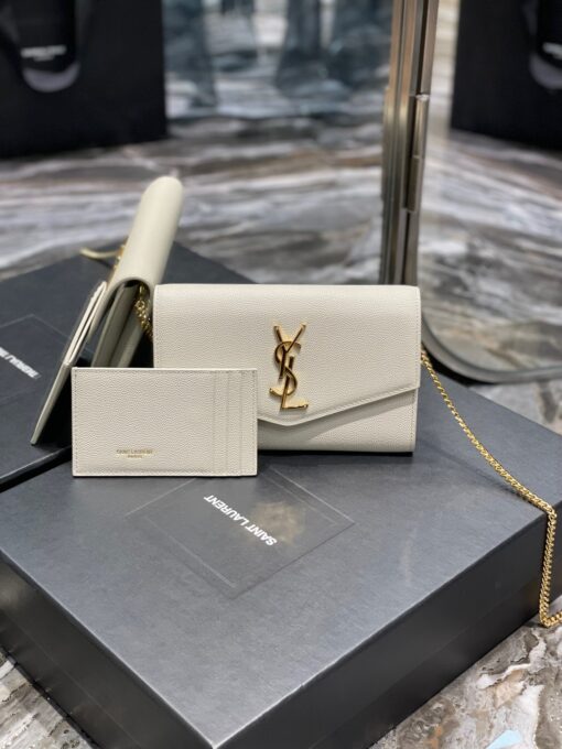 SAINT LAURENT Uptown Chain Wallet. High-End Quality Bag including gift box, care book, dust bag, authenticity card. Mini envelope bag decorated with the cassandre, featuring a removable chain strap for shoulder or hand carry as a clutch. A fragments card case with three card slots is included. | CRIS AND COCO Authentic Quality Luxury Accessories