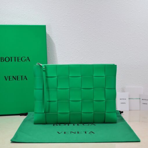 BOTTEGA VENETA Large Intreccio Leather Pouch.  High-End Quality Bag including gift box, care book, dust bag, authenticity card. This stylish zipped pouch from Bottega Veneta is a handy accessory to have. It is expertly crafted from a luxurious leather featuring the signature Intreccio weave. It features a removable wristlet so you can carry it however you desire. It also has a smooth leather interior lining which adds to its fine quality. It closes with a reliable metal zipper that runs across the top. Its multifunctional design makes it an essential addition to any wardrobe. | CRIS AND COCO Authentic Quality Luxury Accessories