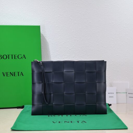 BOTTEGA VENETA Large Intreccio Leather Pouch.  High-End Quality Bag including gift box, care book, dust bag, authenticity card. This stylish zipped pouch from Bottega Veneta is a handy accessory to have. It is expertly crafted from a luxurious leather featuring the signature Intreccio weave. It features a removable wristlet so you can carry it however you desire. It also has a smooth leather interior lining which adds to its fine quality. It closes with a reliable metal zipper that runs across the top. Its multifunctional design makes it an essential addition to any wardrobe. | CRIS AND COCO Authentic Quality Luxury Accessories