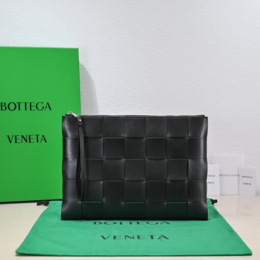 BOTTEGA VENETA Large Intreccio Leather Pouch.  High-End Quality Bag including gift box, care book, dust bag, authenticity card. This stylish zipped pouch from Bottega Veneta is a handy accessory to have. It is expertly crafted from a luxurious leather featuring the signature Intreccio weave. It features a removable wristlet so you can carry it however you desire. It also has a smooth leather interior lining which adds to its fine quality. It closes with a reliable metal zipper that runs across the top. Its multifunctional design makes it an essential addition to any wardrobe. | CRIS AND COCO Authentic Quality Luxury Accessories