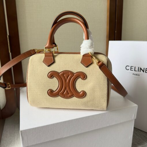 CELINE Small Boston Cuir Triomphe. Style meets sophistication with this timeless Celine Bag. The Celine Small Boston Cuir Triomphe is a classic accessory that is perfect for both day and night. It is made out of smooth calfskin leather with a stitched monogram pattern that creates an elegant, modern look. The bag features a removable and adjustable shoulder strap, a top handle for carrying, and a zipped closure. It also has a main spacious compartment, and one inner flat pocket. It has a small and compact size, perfect for days when you don't want to carry too much. The timeless design will never go out of style, and you'll be sure to feel confident and stylish with this bag on your arm. | CRIS AND COCO Authentic Quality Luxury Accessories