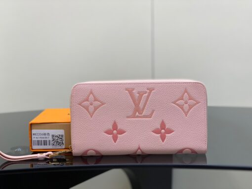 LOUIS VUITTON Zippy Wallet – Where Luxury Meets Functionality. Presenting the exquisite Zippy wallet, a coveted piece from the LV Gradient collection for this season. Meticulously fashioned using grained, embossed Monogram Empreinte leather, it showcases a gracefully transitioning spectrum of summery hues. This iconic wallet is distinguished by its sleek, slender profile, dependable zip closure, and ingeniously designed interior replete with an array of card slots, pockets, and compartments, ensuring both style and functionality in one harmonious package.