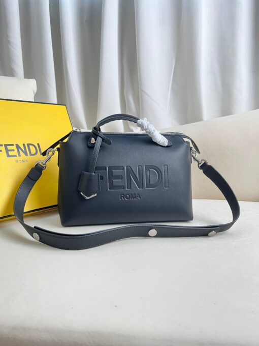 FENDI By The Way- Where Luxury Meets Versatility in Every Detail. Introducing the medium-sized iconic By The Way Boston bag, expertly crafted from luxurious leather and adorned with the prestigious "FENDI ROMA" hot-stamp detail, elegantly sealed with a secure zipper closure. Versatility meets style with multiple carrying options, as you can gracefully hold it by the handles, sling it over your shoulder, or even wear it cross-body, thanks to the adjustable and detachable shoulder strap. Elevate your everyday with the By The Way Boston bag, where elegance meets functionality.