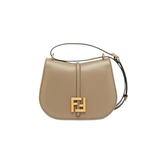 FENDI C’mon Medium. Timeless Elegance, Embodied in Leather. Elegantly designed, this medium-sized satchel bag boasts graceful, curved lines that exude femininity. Its elongated flap is adorned with a striking metal FF logo, adding a touch of sophistication to its overall charm. Crafted from supple leather with meticulously embossed edges and intricate details, this bag radiates a sense of refined luxury. The sides of the bag seamlessly blend with the overall design, crafted from the same tone-on-tone full-grain leather, ensuring a harmonious and visually pleasing aesthetic.