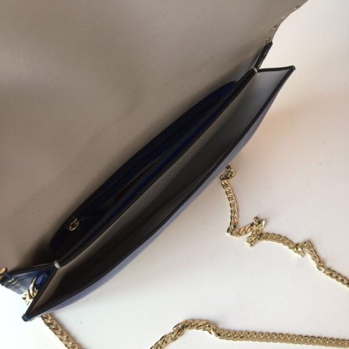 VALENTINO The Rockstud Leather Clutch. Authentic quality luxury bag crafted in genuine leather comes with authenticity card, dust bag and gift bag. Iconic Elegance in Every Detail. This Rockstud Leather Clutch is a compact and luxurious clutch made with high-quality leather and adorned with signature Rockstud detailing. It features a detachable wrist strap and is perfect for carrying essentials. The sleek design and brand logo embossing make it an ideal accessory for special occasions.