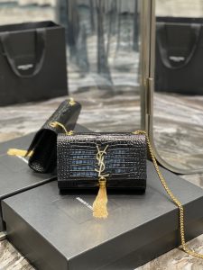 SAINT LAURENT Small 'Kate' Bag with Tassel. Authentic quality luxury bag crafted in genuine leather comes with authenticity card, dust bag and gift bag. Discover the epitome of elegance. Elegantly designed, the Monogram SAINT LAURENT bag is embellished with a sleek curb chain, interlocking YSL initials in metal, and a shimmering metallic tassel. Meticulously crafted from supple leather, the Kate shoulder bag by Saint Laurent showcases a distinctive YSL monogram plaque and a dangling tassel detail on the front, adding an exquisite touch. This exquisite accessory is ideal for a night out, serving as the perfect go-to option. It features a chain shoulder strap, a secure foldover top with magnetic closure, a spacious main compartment, an internal slip pocket, a logo patch, a logo stamp, and exquisite metal hardware for a sophisticated finish. - KRIS + KIKO SAINT LAURENT Small 'Kate' Bag with Tassel.