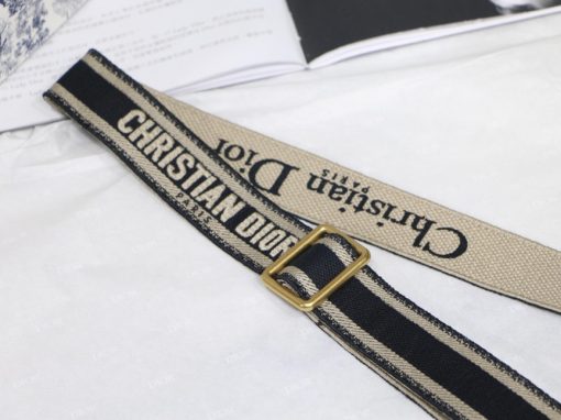DIOR Christian Dior Shoulder Strap. Authentic quality luxury strap crafted in genuine leather comes with authenticity card, dust bag and gift bag. A perfect fusion of elegance and personalization. The elegant 'Christian Dior' insignia is prominently displayed in the middle of the sleek silhouette, adorned by refined black calfskin on both sides. To securely fasten the strap to the chosen bag, two exquisite metal snap hooks with an antique gold finish are employed. This versatile strap can be effortlessly worn either over the shoulder or across the body, allowing for a truly tailored and unique aesthetic.