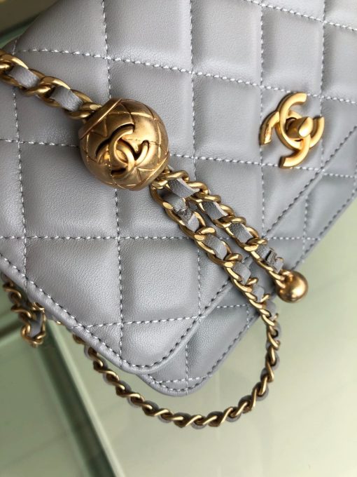 CHANEL Classic WOC Golden Knob Bag. Authentic quality luxury bag crafted in genuine leather comes with authenticity card, dust bag and gift bag. Unforgettable style meets effortless functionality. The Classic WOC bag by CHANEL exudes a distinctive charm, courtesy of its iconic symbols and impeccable construction. Skillfully crafted from luxurious lambskin and adorned with dazzling gold-tone hardware, the bag showcases the iconic CC logo, resulting in a truly unforgettable aesthetic. Upon opening this delightful quilted bag, you'll discover a multitude of zip and slip pockets, designed to keep your cards and essentials safe, allowing you to embark on a carefree and enjoyable experience.