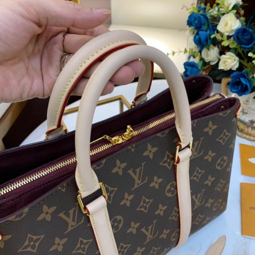 LOUIS VUITTON Soufflot. Authentic quality luxury bag crafted in genuine leather comes with authenticity card, dust bag and gift bag. Sophistication meets practicality. The sophisticated Soufflot MM is skillfully crafted with Monogram canvas, complemented by two stylish leather bands reminiscent of the famous Keepall design. Its capacious interior is thoughtfully arranged for optimal organization. This versatile bag can be carried gracefully by hand or on the elbow, thanks to its refined leather top handles, or effortlessly draped over the shoulder, courtesy of its adjustable and detachable shoulder strap.