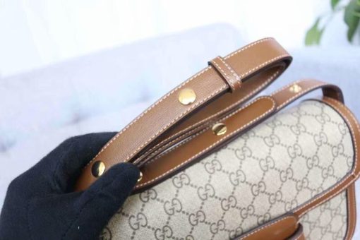 GUCCI 1955 Horsebit Shoulder Bag. Authentic quality luxury bag crafted in genuine leather comes with authenticity card, dust bag and gift bag. Timeless Elegance Meets Modern Versatility. The Gucci 1955 Horsebit bag, a recreation of an archival design, was introduced for Cruise 2020. Maintaining the same elegant lines and forms from over sixty years ago, this accessory seamlessly blends original details with a modern sensibility, placing emphasis on the iconic Horsebit. As an integral part of Gucci's genetic code, the double ring and bar design is recognized as one of the House's most distinctive elements drawn from the equestrian world. Showcased on a compact flap shoulder bag, the hardware is perfectly complemented by the House's recognizable monogram fabric. Furthermore, the bag incorporates a unique mechanism that allows for adjustable shoulder strap length, providing versatility for both shoulder and cross-body wear.
