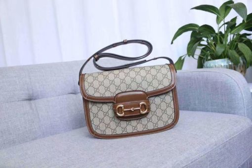 GUCCI 1955 Horsebit Shoulder Bag. Authentic quality luxury bag crafted in genuine leather comes with authenticity card, dust bag and gift bag. Timeless Elegance Meets Modern Versatility. The Gucci 1955 Horsebit bag, a recreation of an archival design, was introduced for Cruise 2020. Maintaining the same elegant lines and forms from over sixty years ago, this accessory seamlessly blends original details with a modern sensibility, placing emphasis on the iconic Horsebit. As an integral part of Gucci's genetic code, the double ring and bar design is recognized as one of the House's most distinctive elements drawn from the equestrian world. Showcased on a compact flap shoulder bag, the hardware is perfectly complemented by the House's recognizable monogram fabric. Furthermore, the bag incorporates a unique mechanism that allows for adjustable shoulder strap length, providing versatility for both shoulder and cross-body wear.