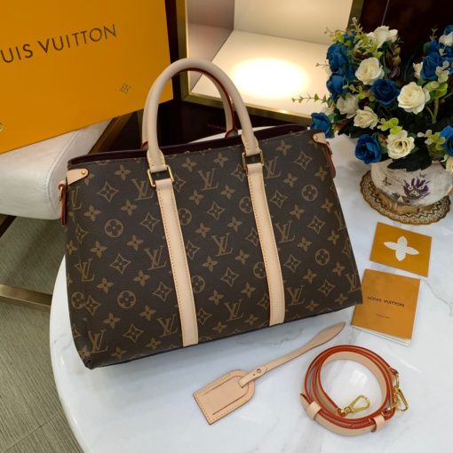 LOUIS VUITTON Soufflot. High-end quality bag including gift box, literature, dust bag, authenticity card. Made from Monogram canvas and featuring two lateral leather bands inspired by the iconic Keepall, the new Soufflot MM has a spacious, well-organized interior. It can be carried by hand and on the elbow with its articulated leather top handles, or on the shoulder, thanks to its removable and adjustable shoulder strap.