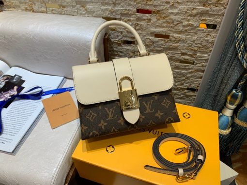 LOUIS VUITTON Locky BB Shoulder Bag. Authentic quality luxury bag crafted in genuine leather comes with authenticity card, dust bag and gift bag. Refinement meets bold style effortlessly. The Locky BB bag in Epi leather is a compact and elegant accessory that effortlessly merges sophistication and audacious style. Its oversized gold-metal LV padlock closure adds a striking statement touch. This fashionable bag seamlessly transitions from day to evening, offering multiple wearing options to complement the mood or occasion. Whether carried by hand, elegantly draped on the elbow, casually slung over the shoulder, or worn crossbody with its detachable strap, the Locky BB bag embodies versatility and timeless appeal.