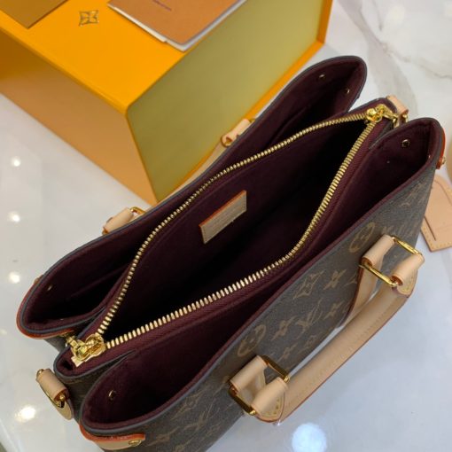 LOUIS VUITTON Soufflot. High-end quality bag including gift box, literature, dust bag, authenticity card. Made from Monogram canvas and featuring two lateral leather bands inspired by the iconic Keepall, the new Soufflot MM has a spacious, well-organized interior. It can be carried by hand and on the elbow with its articulated leather top handles, or on the shoulder, thanks to its removable and adjustable shoulder strap.