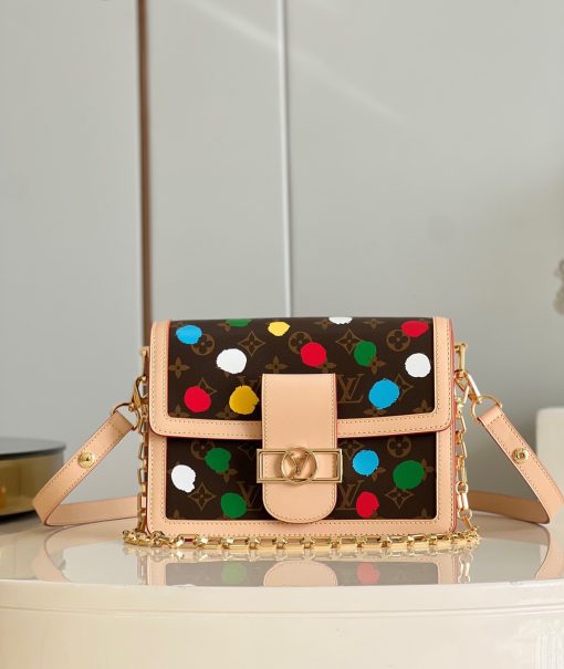 LOUIS VUITTON X Yayoi Kusama Dauphine MM. Authentic quality luxury bag crafted in genuine leather comes with authenticity card, dust bag and gift bag. Classic meets creativity in a rainbow-hued masterpiece. The LVxYK Dauphine MM gracefully embraces the enchanting "Painted Dots" theme within the esteemed LOUIS VUITTON x Yayoi Kusama collection. Renowned for her lifelong affinity towards dots, the illustrious Japanese artist immerses the Dauphine in a mesmerizing array of rainbow-colored dots, meticulously screen-printed on Monogram canvas with a remarkable 3D hand-painted effect. This vibrant and lively interpretation breathes a renewed sense of artistic vitality into an iconic bag.