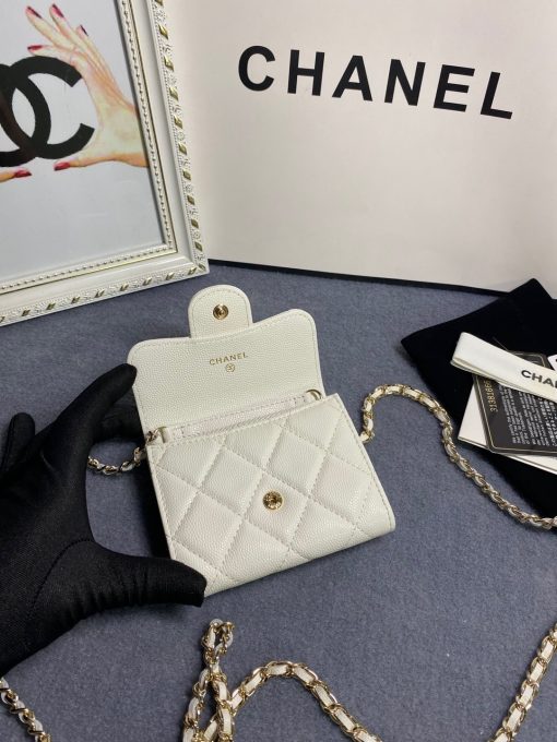 CHANEL Classic Mini Clutch With Chain. Authentic quality luxury bag crafted in genuine leather comes with authenticity card, dust bag and gift bag. Elegance in a Compact Size. The Chanel Classic Mini Clutch is a truly authentic beauty, as it bears a striking resemblance to the iconic Classic Flap Bag. Additionally, it is the compact version of the Clutch With Chain Bag. Despite its small size, this Mini Clutch offers numerous advantages. Notably, it includes a lengthy chain that allows for effortless shoulder carry. This versatile handbag can function as an extra wallet within a larger bag during the day, and as a charming evening accessory during the night.