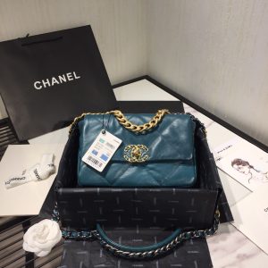 CHANEL '19' Flap Bag. Authentic quality luxury bag crafted in genuine leather comes with authenticity card, dust bag and gift bag. A Timeless Evolution of Elegance. Chanel's latest masterpiece, the Chanel 19 Bag, is the result of a collaboration with the brilliant designer Virginie Viard. This exquisite creation took center stage at the prestigious Paris Fashion Week, captivating fashion enthusiasts from around the world. Aptly named after its birth year, the Chanel 19 Bag draws inspiration from the iconic 2.55 bag, paying homage to its timeless elegance. - KRIS + KIKO CHANEL '19' Flap Bag. High-end quality bag including gift box, literature, dust bag, authenticity card. Chanel's newest bag was designed along with Virginie Viard, and it made its debut on the runway of Paris Fashion Week earlier this year. The bag, called the Chanel 19 Bag, is aptly named after its birth year, and it is said to be inspired by the classic 2.55 bag.