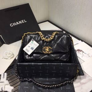 CHANEL '19' Flap Bag. Authentic quality luxury bag crafted in genuine leather comes with authenticity card, dust bag and gift bag. A Timeless Evolution of Elegance. Chanel's latest masterpiece, the Chanel 19 Bag, is the result of a collaboration with the brilliant designer Virginie Viard. This exquisite creation took center stage at the prestigious Paris Fashion Week, captivating fashion enthusiasts from around the world. Aptly named after its birth year, the Chanel 19 Bag draws inspiration from the iconic 2.55 bag, paying homage to its timeless elegance. - KRIS + KIKO CHANEL '19' Flap Bag. High-end quality bag including gift box, literature, dust bag, authenticity card. Chanel's newest bag was designed along with Virginie Viard, and it made its debut on the runway of Paris Fashion Week earlier this year. The bag, called the Chanel 19 Bag, is aptly named after its birth year, and it is said to be inspired by the classic 2.55 bag.