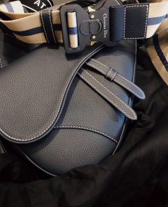DIOR Men Kim Jones Saddle Leather Bag. Authentic quality luxury bag crafted in genuine leather comes with authenticity card, dust bag and gift bag. Embrace the Timeless Evolution of the DIOR Saddle Bag. The legendary DIOR saddle bag made its debut at the women's spring/summer ready-to-wear show in 2000, capturing the hearts of fashion enthusiasts. In a momentous event, DIOR MEN designer Kim Jones reintroduced this iconic bag during his prestigious second show in Tokyo in December 2018, cleverly revamping it into a visionary accessory fit for the future. This remarkable transformation paved the way for a breathtaking evolution, witnessed in the mesmerizing autumn/winter 19 collection presented by DIOR at Paris Fashion Week, allowing the bag's legacy to continue with renewed vitality and enchantment. - KRIS + KIKO DIOR Men Kim Jones Saddle Leather Bag. Original Quality Bag. Authentic Style. Genuine Calf Leather. Metal Hardware. Authentic Packaging. Original Quality Dust Bag. The iconic DIOR saddle bag made its first appearance at the women’s spring/summer ready-to-wear show in 2000. In December 2018, DIOR MEN designer Kim Jones brought the bag out for his second show in Tokyo, transforming it into an accessory of the future. A real update of the piece, which found its continuation in the autumn/winter 19 collection Dior presented during Paris Fashion Week.