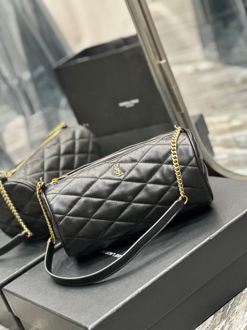 SAINT LAURENT Sade Tube Bag. Authentic quality luxury bag crafted in genuine leather comes with authenticity card, dust bag and gift bag. Indulge in timeless luxury with the YSL "Sade" shoulder bag - where elegance meets functionality. Introducing the exquisite "Sade" shoulder bag by Saint Laurent, crafted from quilted lambskin leather. Adorning the front is the iconic YSL logo lettering, adding a touch of elegance. The bag comes with a chain and leather shoulder strap for comfortable wearability, while the zip top closure ensures the security of your belongings. Inside, you'll find a convenient slip pocket for easy organization. Experience luxury and style with this quintessential Saint Laurent accessory.