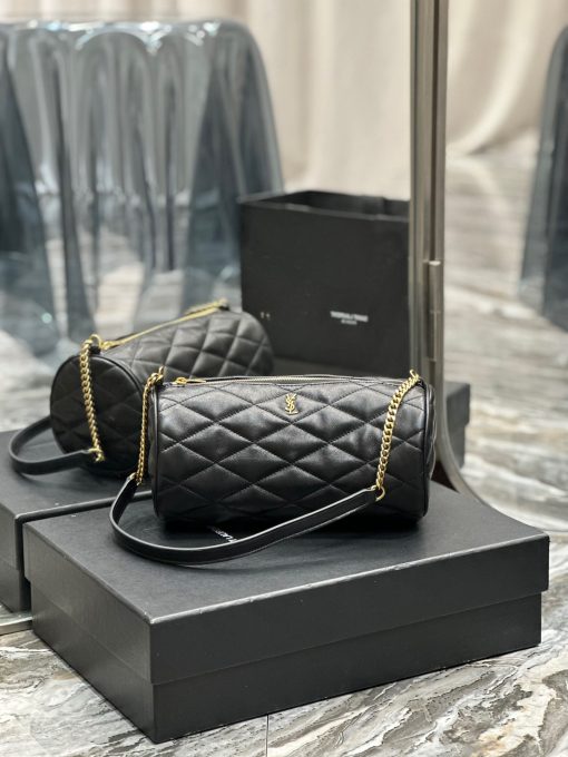 SAINT LAURENT Sade Tube Bag. Authentic quality luxury bag crafted in genuine leather comes with authenticity card, dust bag and gift bag. Indulge in timeless luxury with the YSL "Sade" shoulder bag - where elegance meets functionality. Introducing the exquisite "Sade" shoulder bag by Saint Laurent, crafted from quilted lambskin leather. Adorning the front is the iconic YSL logo lettering, adding a touch of elegance. The bag comes with a chain and leather shoulder strap for comfortable wearability, while the zip top closure ensures the security of your belongings. Inside, you'll find a convenient slip pocket for easy organization. Experience luxury and style with this quintessential Saint Laurent accessory.