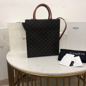 CELINE Vertical Cabas Tote in Triomphe Canvas and Calfskin. Authentic quality luxury bag crafted in genuine leather comes with authenticity card, dust bag and gift bag. A Collection of Timeless Elegance and Unyielding Style. Initially, the Triomphe bag faced indifference, but it is now gathering momentum and acclaim. The journey began with the CELINE Triomphe bag, a splendid creation honoring the iconic Arc de Triomphe. A new chapter unfolds as CELINE unveils a comprehensive range of the Triomphe line, which encompasses a tote bag, bucket bag, camera bag, drawstring bag, and a Boston bag. Crafted with Triomphe canvas and adorned with refined calfskin trimming, each style exudes an extraordinary allure. - KRIS + KIKO CELINE Vertical Cabas Tote in Triomphe Canvas and Calfskin. Authentic quality luxury bag crafted in genuine leather comes with authenticity card, dust bag and gift bag. A Collection of Timeless Elegance and Unyielding Style. Initially, the Triomphe bag faced indifference, but it is now gathering momentum and acclaim. The journey began with the CELINE Triomphe bag, a splendid creation honoring the iconic Arc de Triomphe. A new chapter unfolds as CELINE unveils a comprehensive range of the Triomphe line, which encompasses a tote bag, bucket bag, camera bag, drawstring bag, and a Boston bag. Crafted with Triomphe canvas and adorned with refined calfskin trimming, each style exudes an extraordinary allure.