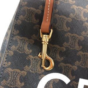 CELINE Vertical Cabas Tote in Triomphe Canvas and Calfskin. Authentic quality luxury bag crafted in genuine leather comes with authenticity card, dust bag and gift bag. A Collection of Timeless Elegance and Unyielding Style. Initially, the Triomphe bag faced indifference, but it is now gathering momentum and acclaim. The journey began with the CELINE Triomphe bag, a splendid creation honoring the iconic Arc de Triomphe. A new chapter unfolds as CELINE unveils a comprehensive range of the Triomphe line, which encompasses a tote bag, bucket bag, camera bag, drawstring bag, and a Boston bag. Crafted with Triomphe canvas and adorned with refined calfskin trimming, each style exudes an extraordinary allure. - KRIS + KIKO CELINE Vertical Cabas Tote in Triomphe Canvas and Calfskin. Authentic quality luxury bag crafted in genuine leather comes with authenticity card, dust bag and gift bag. A Collection of Timeless Elegance and Unyielding Style. Initially, the Triomphe bag faced indifference, but it is now gathering momentum and acclaim. The journey began with the CELINE Triomphe bag, a splendid creation honoring the iconic Arc de Triomphe. A new chapter unfolds as CELINE unveils a comprehensive range of the Triomphe line, which encompasses a tote bag, bucket bag, camera bag, drawstring bag, and a Boston bag. Crafted with Triomphe canvas and adorned with refined calfskin trimming, each style exudes an extraordinary allure.