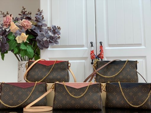 LOUIS VUITTON Pallas Clutch Bag. Authentic quality luxury bag crafted in genuine leather comes with authenticity card, dust bag and gift bag. Your go-to for small but stunning style. This exquisite handbag is adorned with the iconic Monogram Canvas and offers versatile carrying options, allowing you to wear it comfortably on your shoulder or across your body. You can choose between the leather strap or the elegant golden chain, making it perfect as a Wallet on Chain bag for evenings or when you want to carry a stunning small handbag. Additionally, it effortlessly complements any casual outfit. The Clutch Bag is beautifully accented with golden metallic pieces and features a convenient central zipped compartment as well as an exterior front pocket.