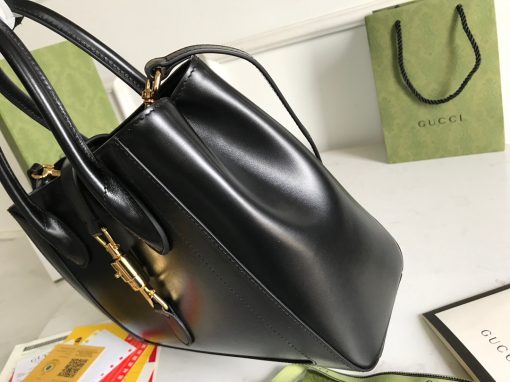 GUCCI Jackie 1961 Medium Tote Bag. Authentic quality luxury bag crafted in genuine leather comes with authenticity card, dust bag and gift bag. Embrace Timeless Elegance with Jackie 1961: A Tote Bag Redefined. Introducing the stunning Jackie 1961 tote bag from the prestigious Epilogue collection. This exquisite piece combines the finest materials of leather and GG Supreme Canvas, resulting in a medium-sized style that exudes sophistication. The iconic piston closure serves as the defining feature of this elegant accessory, perfectly enhancing its overall allure. Additionally, it includes a practical detachable shoulder strap for added convenience. Immerse yourself in the enriched world of Jackie 1961 with this remarkable tote bag.