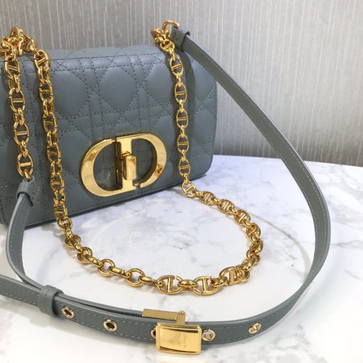 DIOR Small Caro Bag. Authentic quality luxury bag crafted in genuine leather comes with authenticity card, dust bag and gift bag. Timeless Elegance meets Versatile Style. The Dior Small Caro Bag is reminiscent of the Lady Dior Bag with its iconic Cannage Stitching, exuding both femininity and timeless style. The Cannage Stitching is instantly recognizable as one of the house's most historic and iconic patterns. At the center of the bag, a new metal twist CD Lock catches the eye with its large size. The top of the bag is adorned with a signature CD chain link shoulder strap, which can be swapped out for a wide embroidered strap to add a playful touch. This versatility allows for the bag to be perfectly paired with different outfits and looks. On the back of the bag, you'll find the distinguished 30 Montaigne signature embossed. Inside, the bag features one spacious main compartment along with interior zip and patch pockets for organization. Additionally, a convenient back pocket is available for quick and easy access to your essentials.
