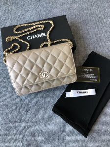 CHANEL Classic Wallet on Chain. Authentic quality luxury bag crafted in genuine leather comes with authenticity card, dust bag and gift bag. Elevate your elegance with the timeless allure of a Chanel bag. A Chanel bag is a true symbol of timeless sophistication and grace, effortlessly elevating any ensemble. Exemplifying this essence is the exquisite caviar leather flap wallet on chain, celebrating the brand's iconic elegance. Adorned with a mesmerizing diamond quilted pattern, complimented by opulent metal-tone hardware, and secured by a chic foldover top with a CC turn-lock fastening, this piece exudes nothing short of refinement. With its thoughtfully designed interior, including an internal zipped pocket, slip pocket, and logo stamp, as well as the added convenience of a back slip pocket, this wallet on chain seamlessly blends both style and practicality. The tasteful tortoiseshell details serve as an impeccable finishing touch, emanating an allure that is truly captivating. - KRIS + KIKO CHANEL Classic Wallet on Chain. Authentic Quality Wallet, including gift box, literature, dust bag, authenticity card. Classic and elegant, a Chanel bag is a fashion statement to your outfit, as seen in this caviar leather flap wallet on chain. Featuring a diamond quilted finish, metal-tone hardware, a foldover top, an internal zipped pocket, an internal slip pocket, an internal logo stamp, a back slip pocket, tortoiseshell details, and a CC turn-lock fastening.