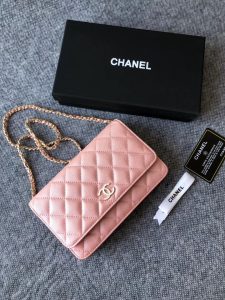 CHANEL Classic Wallet on Chain. Authentic quality luxury bag crafted in genuine leather comes with authenticity card, dust bag and gift bag. Elevate your elegance with the timeless allure of a Chanel bag. A Chanel bag is a true symbol of timeless sophistication and grace, effortlessly elevating any ensemble. Exemplifying this essence is the exquisite caviar leather flap wallet on chain, celebrating the brand's iconic elegance. Adorned with a mesmerizing diamond quilted pattern, complimented by opulent metal-tone hardware, and secured by a chic foldover top with a CC turn-lock fastening, this piece exudes nothing short of refinement. With its thoughtfully designed interior, including an internal zipped pocket, slip pocket, and logo stamp, as well as the added convenience of a back slip pocket, this wallet on chain seamlessly blends both style and practicality. The tasteful tortoiseshell details serve as an impeccable finishing touch, emanating an allure that is truly captivating. - KRIS + KIKO CHANEL Classic Wallet on Chain. Authentic Quality Wallet, including gift box, literature, dust bag, authenticity card. Classic and elegant, a Chanel bag is a fashion statement to your outfit, as seen in this caviar leather flap wallet on chain. Featuring a diamond quilted finish, metal-tone hardware, a foldover top, an internal zipped pocket, an internal slip pocket, an internal logo stamp, a back slip pocket, tortoiseshell details, and a CC turn-lock fastening.