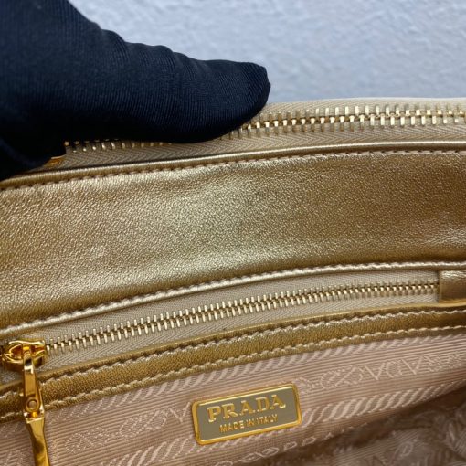 PRADA Galleria Satin Mini Bag With Crystals. Original Quality Bag including gift box, care book, dust bag, authenticity card. A surface of dazzling crystals in various sizes creates a precious play of sparkles and glimmers on this Prada Galleria bag, recalling the jewelry world. The accessory, which exemplifies the centennial excellence of Prada in luxury leather goods, becomes a reflection of the brand's modernity and stylistic identity that seeks to interpret kaleidoscopic contemporaneity through a pragmatic design and structured lines. Presented in a mini version, the bag is made of fine silk satin. The Prada Galleria bag, named after the historic Prada store opened by Mario Prada in 1913 in Galleria Vittorio Emanuele II in Milan, expresses the quintessence of the brand's timeless elegance.