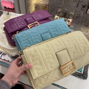 FENDI Baguette Shoulder Bag. Authentic quality luxury bag crafted in genuine leather comes with authenticity card, dust bag and gift bag. Rediscover the Icon. Introducing the highly anticipated comeback of the original It bag. As the Nineties trend continues to captivate fashion enthusiasts, Fendi's iconic Baguette bag, first introduced in 1997, takes the spotlight once again. Back then, the Baguette revolutionized bag fashion, capturing the hearts of women who desired to possess multiple designs. Unlike its predecessors, such as Chanel's 2.55 and Hermes' Kelly and Birkin styles, the Baguette was not only fashionable but also innovative. Its allure was twofold - a wide range of captivating designs to collect and a convenient and comfortable silhouette to carry. The return of this coveted accessory is a testament to its enduring desirability. - KRIS + KIKO FENDI Baguette Shoulder Bag. High-End Quality Bag.. Authentic Style. Genuine Calf Leather. Metal Hardware. Authentic Packaging. Original Quality and Look Dust Bag. The original It bag is back. As the trend for everything the Nineties rolls on, it’s only right that Fendi’s iconic Baguette bag, which was created in 1997, has another turn in the spotlight. At the time, the Baguette quickly transcended any previous bag trends and became a phenomenon with women desperate to own as many designs as possible. There had never been such a fashionable yet high-end bag - yes, there were classics like Chanel’s 2.55 and Hermes’ Kelly and Birkin styles but the Baguette was new and fashion-led. It’s desirability was two-fold… there were dozens of different designs to collect and it came in a tactile easy-to-carry silhouette.