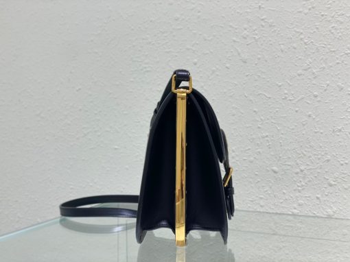 DIOR Bobby Frame Bag. Authentic quality luxury bag crafted in genuine leather comes with authenticity card, dust bag and gift bag. Elegance reimagined: Retro charm meets modern sophistication Taking inspiration from a vintage Marc Bohan creation, the Dior Bobby Frame bag designed by Maria Grazia Chiuri exudes an air of elegance and retro allure. Crafted with meticulous attention to detail using box calfskin, this bag stands out with its structured shape, secure flap closure, and exquisite antique gold-finish metal accents. The bag also features a versatile, adjustable sliding shoulder strap adorned with a military-style buckle, allowing it to be carried by hand, worn over the shoulder, or styled crossbody.