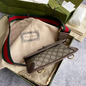 GUCCI Neo Vintage GG Supreme Belt Bag. Authentic quality luxury bag crafted in genuine leather comes with authenticity card, dust bag and gift bag. Retro charm, sustainable grace. The GG Supreme belt bag exudes a tasteful vintage charm, showcasing a design that draws inspiration from the past. Constructed with genuine leather accents, this exquisite piece is designed to be comfortably worn around the waist, fastened securely with a stylish Web strap and buckle closure. Crafted from environmentally conscious beige/ebony GG Supreme canvas and adorned with brown leather trims, this bag exemplifies both style and sustainability. It proudly displays the iconic green and red Web detailing, embodying the unmistakable Gucci essence. Additionally, it features an oval-shaped Gucci leather tag adorned with a captivating feline head emblem. The adjustable nylon Web belt offers flexibility and convenience, guaranteed by a sturdy plastic buckle closure. - KRIS + KIKO GUCCI Neo Vintage GG Supreme Belt Bag. Authentic quality luxury bag crafted in genuine leather comes with authenticity card, dust bag and gift bag. Retro charm, sustainable grace. The GG Supreme belt bag exudes a tasteful vintage charm, showcasing a design that draws inspiration from the past. Constructed with genuine leather accents, this exquisite piece is designed to be comfortably worn around the waist, fastened securely with a stylish Web strap and buckle closure. Crafted from environmentally conscious beige/ebony GG Supreme canvas and adorned with brown leather trims, this bag exemplifies both style and sustainability. It proudly displays the iconic green and red Web detailing, embodying the unmistakable Gucci essence. Additionally, it features an oval-shaped Gucci leather tag adorned with a captivating feline head emblem. The adjustable nylon Web belt offers flexibility and convenience, guaranteed by a sturdy plastic buckle closure.