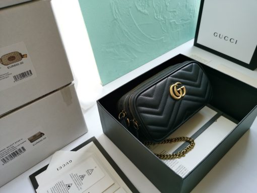 GUCCI GG Marmont Mini Chain Bag. Authentic quality luxury bag crafted in genuine leather comes with authenticity card, dust bag and gift bag. Style meets functionality in a compact and adorable package. The GG Marmont Mini Chain Bag is exquisitely adorned with chevron leather and features a delightful heart embellishment on its back. Its slender, softly structured form boasts three convenient zippered compartments. The front showcases the ultra-stylish GG logo, painstakingly crafted with antique gold hardware, lending a touch of vintage charm. The interior is lined with moiré and microfiber, pleasantly resembling suede. In addition, two card slots and a 60cm drop chain strap are included. Despite its compact size, this bag is undeniably cute, especially when elegantly draped over the shoulder.
