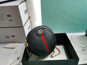 GUCCI GG Marmont Mini Leather Round Shoulder Bag. Authentic quality luxury bag crafted in genuine leather comes with authenticity card, dust bag and gift bag. Effortlessly chic, this shoulder bag proves that good things come in small packages. This delightful shoulder bag is definitely a perfect choice! Mini bags are incredibly popular this season, and it's great to show our support for this trend. Gucci has designed this bag specifically for carrying essentials - your phone will be easily accessible, your credit card can be conveniently kept in your pocket, and your lipstick will last you all day long. Made from either plain or quilted leather, this fun-sized accessory features a stylish chain and leather shoulder strap, as well as the iconic metal GG logo. Sometimes, the best things truly do come in small packages. With a top zip closure and beautiful gold or silver-tone hardware, this shoulder bag completes the package. - KRIS + KIKO GUCCI GG Marmont Mini Leather Round Shoulder Bag. This Gucci GG Marmont mini round shoulder bag certainly seems to fit the bill! Mini bags are hot this season and we could be more supportive of this trend. This bag from Gucci is only for essentials, the phone will be on your hands, the credit card in your pocket and your lipstick have a 24-hour duration. Crafted from plain/quilted leather, this fun-size accessory has a chain and leather shoulder strap and is adorned with the signature metal GG logo. All the best things come in small packages. Featuring a top zip fastening and gold-tone/silver-tone hardware.