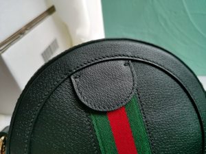GUCCI GG Marmont Mini Leather Round Shoulder Bag. Authentic quality luxury bag crafted in genuine leather comes with authenticity card, dust bag and gift bag. Effortlessly chic, this shoulder bag proves that good things come in small packages. This delightful shoulder bag is definitely a perfect choice! Mini bags are incredibly popular this season, and it's great to show our support for this trend. Gucci has designed this bag specifically for carrying essentials - your phone will be easily accessible, your credit card can be conveniently kept in your pocket, and your lipstick will last you all day long. Made from either plain or quilted leather, this fun-sized accessory features a stylish chain and leather shoulder strap, as well as the iconic metal GG logo. Sometimes, the best things truly do come in small packages. With a top zip closure and beautiful gold or silver-tone hardware, this shoulder bag completes the package. - KRIS + KIKO CRIS&COCO Authentic Quality Designer Bags and Luxury Accessories