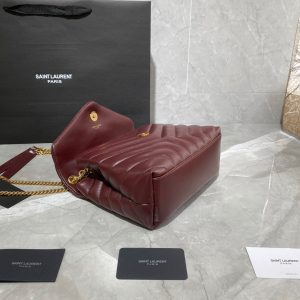 SAINT LAURENT Small Loulou Matelassé Bag. Authentic quality luxury bag crafted in genuine leather comes with authenticity card, dust bag and gift bag. Femininity meets rock and roll elegance. The SAINT LAURENT Small Loulou Matelassé Bag exudes a timeless femininity with a hint of edgy rock and roll. Its standout feature is the padded quilted leather, adding dimension and volume to the bag. The leather chain handles and iconic metal interlocking YSL initials on the front flap make a bold yet timeless statement of luxury. The versatility of this bag is another noteworthy aspect, as it effortlessly transitions from casual to formal occasions. The moveable chain strap allows for it to be worn as a crossbody bag, further enhancing its adaptability. - KRIS + KIKO SAINT LAURENT Small Loulou Matelassé Bag. Authentic quality luxury bag crafted in genuine leather comes with authenticity card, dust bag and gift bag. Femininity meets rock and roll elegance. The SAINT LAURENT Small Loulou Matelassé Bag exudes a timeless femininity with a hint of edgy rock and roll. Its standout feature is the padded quilted leather, adding dimension and volume to the bag. The leather chain handles and iconic metal interlocking YSL initials on the front flap make a bold yet timeless statement of luxury. The versatility of this bag is another noteworthy aspect, as it effortlessly transitions from casual to formal occasions. The moveable chain strap allows for it to be worn as a crossbody bag, further enhancing its adaptability.