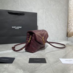 SAINT LAURENT Toy Loulou Matelassé Mini Bag. Authentic quality luxury bag crafted in genuine leather comes with authenticity card, dust bag and gift bag. Embrace Your Inner Rock and Roll Chic. The SAINT LAURENT Toy Loulou Matelassé Mini Bag can be described as a beautifully feminine accessory with a touch of rebellious charm. Its standout feature is the padded quilted leather, which adds volume and texture. The leather chain handles and metal interlocking YSL initials on the front flap give the bag a daring yet timeless allure, making it a luxurious statement piece. The versatility of the YSL LouLou bag is truly impressive, as it can effortlessly transition from casual to formal occasions. The adjustable chain strap allows for the option of wearing it as a crossbody bag, adding to its adaptability. - KRIS + KIKO SAINT LAURENT Toy Loulou Matelassé Mini Bag. If asked to describe the design of the SAINT LAURENT Toy Loulou Matelassé Mini Bag in a few words, we’d say that it is a feminine bag with a slight rock and roll feel to it. One of the most noticeable things about the look of the LouLou is the padded quilted leather, a feature which gives the bag more volume. The leather padded chain handles and the metal interlocking YSL initials on the front flap, make it a bold, yet still classic, luxury handbag. Versatility is another strong point of the YSL LouLou bag, and it can definitely be dressed up or down for any occasion. The chain strap is moveable, which means it can also be worn as a crossbody bag.