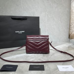 SAINT LAURENT Toy Loulou Matelassé Mini Bag. Authentic quality luxury bag crafted in genuine leather comes with authenticity card, dust bag and gift bag. Embrace Your Inner Rock and Roll Chic. The SAINT LAURENT Toy Loulou Matelassé Mini Bag can be described as a beautifully feminine accessory with a touch of rebellious charm. Its standout feature is the padded quilted leather, which adds volume and texture. The leather chain handles and metal interlocking YSL initials on the front flap give the bag a daring yet timeless allure, making it a luxurious statement piece. The versatility of the YSL LouLou bag is truly impressive, as it can effortlessly transition from casual to formal occasions. The adjustable chain strap allows for the option of wearing it as a crossbody bag, adding to its adaptability. - KRIS + KIKO SAINT LAURENT Toy Loulou Matelassé Mini Bag. Authentic quality luxury bag crafted in genuine leather comes with authenticity card, dust bag and gift bag. Embrace Your Inner Rock and Roll Chic. The SAINT LAURENT Toy Loulou Matelassé Mini Bag can be described as a beautifully feminine accessory with a touch of rebellious charm. Its standout feature is the padded quilted leather, which adds volume and texture. The leather chain handles and metal interlocking YSL initials on the front flap give the bag a daring yet timeless allure, making it a luxurious statement piece. The versatility of the YSL LouLou bag is truly impressive, as it can effortlessly transition from casual to formal occasions. The adjustable chain strap allows for the option of wearing it as a crossbody bag, adding to its adaptability.