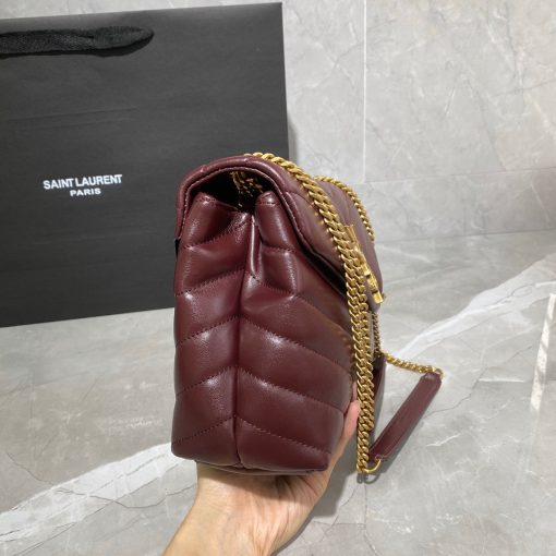 SAINT LAURENT Small Loulou Matelassé Bag. Authentic quality luxury bag crafted in genuine leather comes with authenticity card, dust bag and gift bag. Femininity meets rock and roll elegance. The SAINT LAURENT Small Loulou Matelassé Bag exudes a timeless femininity with a hint of edgy rock and roll. Its standout feature is the padded quilted leather, adding dimension and volume to the bag. The leather chain handles and iconic metal interlocking YSL initials on the front flap make a bold yet timeless statement of luxury. The versatility of this bag is another noteworthy aspect, as it effortlessly transitions from casual to formal occasions. The moveable chain strap allows for it to be worn as a crossbody bag, further enhancing its adaptability.