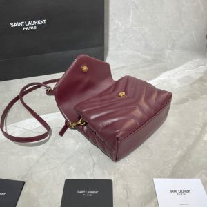 SAINT LAURENT Toy Loulou Matelassé Mini Bag. Authentic quality luxury bag crafted in genuine leather comes with authenticity card, dust bag and gift bag. Embrace Your Inner Rock and Roll Chic. The SAINT LAURENT Toy Loulou Matelassé Mini Bag can be described as a beautifully feminine accessory with a touch of rebellious charm. Its standout feature is the padded quilted leather, which adds volume and texture. The leather chain handles and metal interlocking YSL initials on the front flap give the bag a daring yet timeless allure, making it a luxurious statement piece. The versatility of the YSL LouLou bag is truly impressive, as it can effortlessly transition from casual to formal occasions. The adjustable chain strap allows for the option of wearing it as a crossbody bag, adding to its adaptability. - KRIS + KIKO SAINT LAURENT Toy Loulou Matelassé Mini Bag. If asked to describe the design of the SAINT LAURENT Toy Loulou Matelassé Mini Bag in a few words, we’d say that it is a feminine bag with a slight rock and roll feel to it. One of the most noticeable things about the look of the LouLou is the padded quilted leather, a feature which gives the bag more volume. The leather padded chain handles and the metal interlocking YSL initials on the front flap, make it a bold, yet still classic, luxury handbag. Versatility is another strong point of the YSL LouLou bag, and it can definitely be dressed up or down for any occasion. The chain strap is moveable, which means it can also be worn as a crossbody bag.