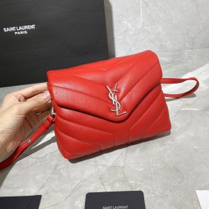 SAINT LAURENT Toy Loulou Matelassé Mini Bag. Authentic quality luxury bag crafted in genuine leather comes with authenticity card, dust bag and gift bag. Embrace Your Inner Rock and Roll Chic. The SAINT LAURENT Toy Loulou Matelassé Mini Bag can be described as a beautifully feminine accessory with a touch of rebellious charm. Its standout feature is the padded quilted leather, which adds volume and texture. The leather chain handles and metal interlocking YSL initials on the front flap give the bag a daring yet timeless allure, making it a luxurious statement piece. The versatility of the YSL LouLou bag is truly impressive, as it can effortlessly transition from casual to formal occasions. The adjustable chain strap allows for the option of wearing it as a crossbody bag, adding to its adaptability. - KRIS + KIKO SAINT LAURENT Toy Loulou Matelassé Mini Bag. If asked to describe the design of the SAINT LAURENT Toy Loulou Matelassé Mini Bag in a few words, we’d say that it is a feminine bag with a slight rock and roll feel to it. One of the most noticeable things about the look of the LouLou is the padded quilted leather, a feature which gives the bag more volume. The leather padded chain handles and the metal interlocking YSL initials on the front flap, make it a bold, yet still classic, luxury handbag. Versatility is another strong point of the YSL LouLou bag, and it can definitely be dressed up or down for any occasion. The chain strap is moveable, which means it can also be worn as a crossbody bag.