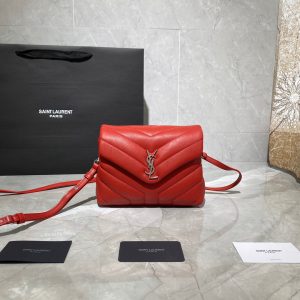 SAINT LAURENT Toy Loulou Matelassé Mini Bag. Authentic quality luxury bag crafted in genuine leather comes with authenticity card, dust bag and gift bag. Embrace Your Inner Rock and Roll Chic. The SAINT LAURENT Toy Loulou Matelassé Mini Bag can be described as a beautifully feminine accessory with a touch of rebellious charm. Its standout feature is the padded quilted leather, which adds volume and texture. The leather chain handles and metal interlocking YSL initials on the front flap give the bag a daring yet timeless allure, making it a luxurious statement piece. The versatility of the YSL LouLou bag is truly impressive, as it can effortlessly transition from casual to formal occasions. The adjustable chain strap allows for the option of wearing it as a crossbody bag, adding to its adaptability. - KRIS + KIKO SAINT LAURENT Toy Loulou Matelassé Mini Bag. Authentic quality luxury bag crafted in genuine leather comes with authenticity card, dust bag and gift bag. Embrace Your Inner Rock and Roll Chic. The SAINT LAURENT Toy Loulou Matelassé Mini Bag can be described as a beautifully feminine accessory with a touch of rebellious charm. Its standout feature is the padded quilted leather, which adds volume and texture. The leather chain handles and metal interlocking YSL initials on the front flap give the bag a daring yet timeless allure, making it a luxurious statement piece. The versatility of the YSL LouLou bag is truly impressive, as it can effortlessly transition from casual to formal occasions. The adjustable chain strap allows for the option of wearing it as a crossbody bag, adding to its adaptability.