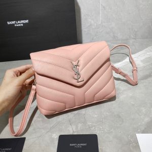 SAINT LAURENT Toy Loulou Matelassé Mini Bag. Authentic quality luxury bag crafted in genuine leather comes with authenticity card, dust bag and gift bag. Embrace Your Inner Rock and Roll Chic. The SAINT LAURENT Toy Loulou Matelassé Mini Bag can be described as a beautifully feminine accessory with a touch of rebellious charm. Its standout feature is the padded quilted leather, which adds volume and texture. The leather chain handles and metal interlocking YSL initials on the front flap give the bag a daring yet timeless allure, making it a luxurious statement piece. The versatility of the YSL LouLou bag is truly impressive, as it can effortlessly transition from casual to formal occasions. The adjustable chain strap allows for the option of wearing it as a crossbody bag, adding to its adaptability. - KRIS + KIKO SAINT LAURENT Toy Loulou Matelassé Mini Bag. If asked to describe the design of the SAINT LAURENT Toy Loulou Matelassé Mini Bag in a few words, we’d say that it is a feminine bag with a slight rock and roll feel to it. One of the most noticeable things about the look of the LouLou is the padded quilted leather, a feature which gives the bag more volume. The leather padded chain handles and the metal interlocking YSL initials on the front flap, make it a bold, yet still classic, luxury handbag. Versatility is another strong point of the YSL LouLou bag, and it can definitely be dressed up or down for any occasion. The chain strap is moveable, which means it can also be worn as a crossbody bag.