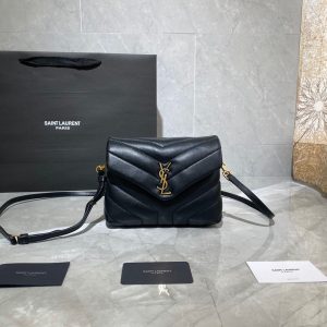 SAINT LAURENT Toy Loulou Matelassé Mini Bag. Authentic quality luxury bag crafted in genuine leather comes with authenticity card, dust bag and gift bag. Embrace Your Inner Rock and Roll Chic. The SAINT LAURENT Toy Loulou Matelassé Mini Bag can be described as a beautifully feminine accessory with a touch of rebellious charm. Its standout feature is the padded quilted leather, which adds volume and texture. The leather chain handles and metal interlocking YSL initials on the front flap give the bag a daring yet timeless allure, making it a luxurious statement piece. The versatility of the YSL LouLou bag is truly impressive, as it can effortlessly transition from casual to formal occasions. The adjustable chain strap allows for the option of wearing it as a crossbody bag, adding to its adaptability. - KRIS + KIKO SAINT LAURENT Toy Loulou Matelassé Mini Bag. If asked to describe the design of the SAINT LAURENT Toy Loulou Matelassé Mini Bag in a few words, we’d say that it is a feminine bag with a slight rock and roll feel to it. One of the most noticeable things about the look of the LouLou is the padded quilted leather, a feature which gives the bag more volume. The leather padded chain handles and the metal interlocking YSL initials on the front flap, make it a bold, yet still classic, luxury handbag. Versatility is another strong point of the YSL LouLou bag, and it can definitely be dressed up or down for any occasion. The chain strap is moveable, which means it can also be worn as a crossbody bag.