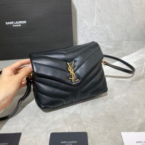 SAINT LAURENT Toy Loulou Matelassé Mini Bag. Authentic quality luxury bag crafted in genuine leather comes with authenticity card, dust bag and gift bag. Embrace Your Inner Rock and Roll Chic. The SAINT LAURENT Toy Loulou Matelassé Mini Bag can be described as a beautifully feminine accessory with a touch of rebellious charm. Its standout feature is the padded quilted leather, which adds volume and texture. The leather chain handles and metal interlocking YSL initials on the front flap give the bag a daring yet timeless allure, making it a luxurious statement piece. The versatility of the YSL LouLou bag is truly impressive, as it can effortlessly transition from casual to formal occasions. The adjustable chain strap allows for the option of wearing it as a crossbody bag, adding to its adaptability. - KRIS + KIKO SAINT LAURENT Toy Loulou Matelassé Mini Bag. If asked to describe the design of the SAINT LAURENT Toy Loulou Matelassé Mini Bag in a few words, we’d say that it is a feminine bag with a slight rock and roll feel to it. One of the most noticeable things about the look of the LouLou is the padded quilted leather, a feature which gives the bag more volume. The leather padded chain handles and the metal interlocking YSL initials on the front flap, make it a bold, yet still classic, luxury handbag. Versatility is another strong point of the YSL LouLou bag, and it can definitely be dressed up or down for any occasion. The chain strap is moveable, which means it can also be worn as a crossbody bag.